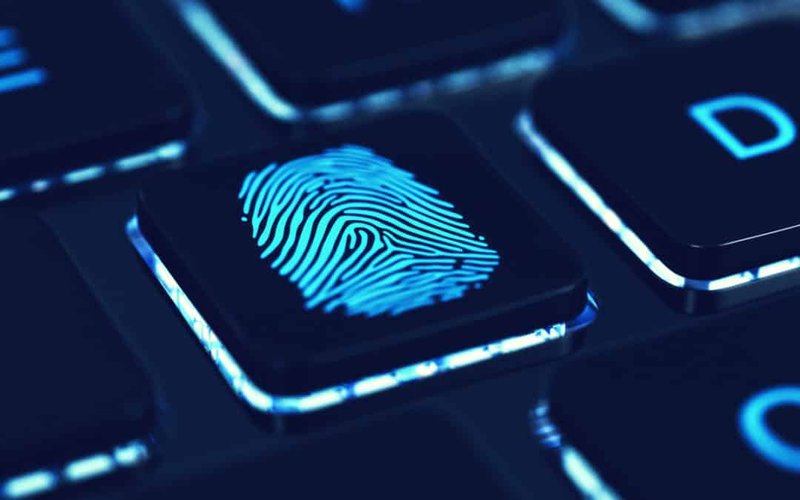 Glowing fingerprint on a keyboard key